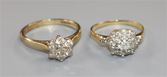 An 18ct gold and diamond flowerhead cluster ring and a 9ct gold and diamond flowerhead cluster ring.